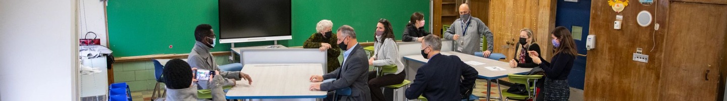  Brown community members meeting with Principal of Vartan Gregorian Elementary Matt Russo about the traveling classroom installed at the school.