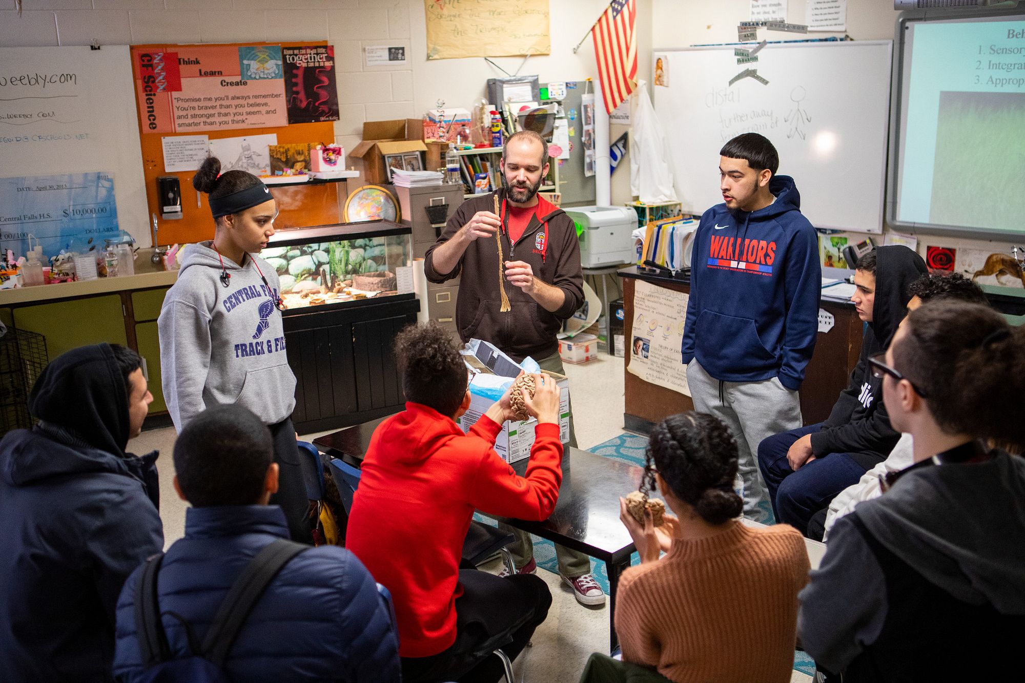 Alastair Tulloch demonstrates the brain to students at the Central Falls High School.
